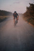 Cyclist riding a gravel road at dawn, CeramicSpeed BB ALPHA lifestyle image