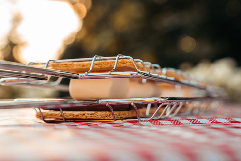 Coghlan's s'mores grill toasting treats over a campfire