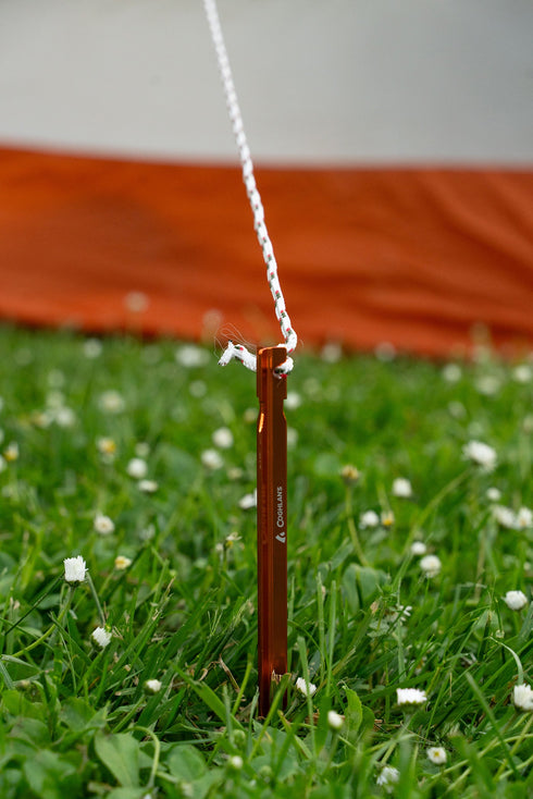 Coghlan's 7 mm utility cord tied to a tent stake as a guy line