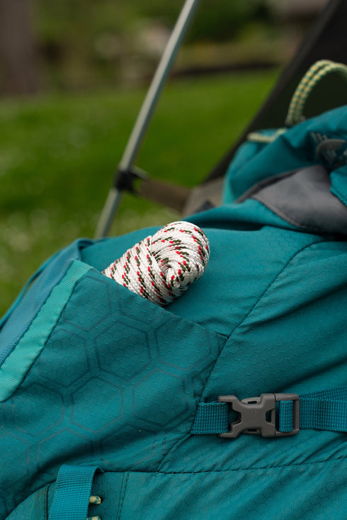 Coghlan's utility cord used as a tent guy line at camp