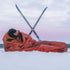 Lifesystems Survival Bag pitched between trekking poles in snow