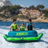 Three riders on a Jobe Binar Towable 3P behind a boat, lifestyle