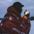 Hiker sheltering in the Lifesystems Thermal Bag outdoors