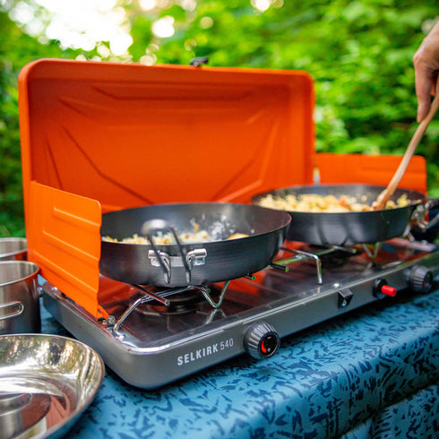 GSI Outdoors Carbon Steel Frypan cooking on a camp stove outdoors