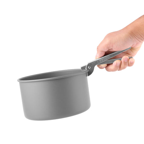 Coghlan's pot holder gripping the rim of a camping pot