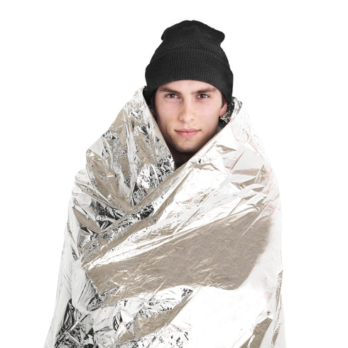 Person wrapped in a Coghlan's emergency blanket, front view