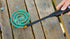 Coghlan's mosquito coil burning on a wooden deck outdoors