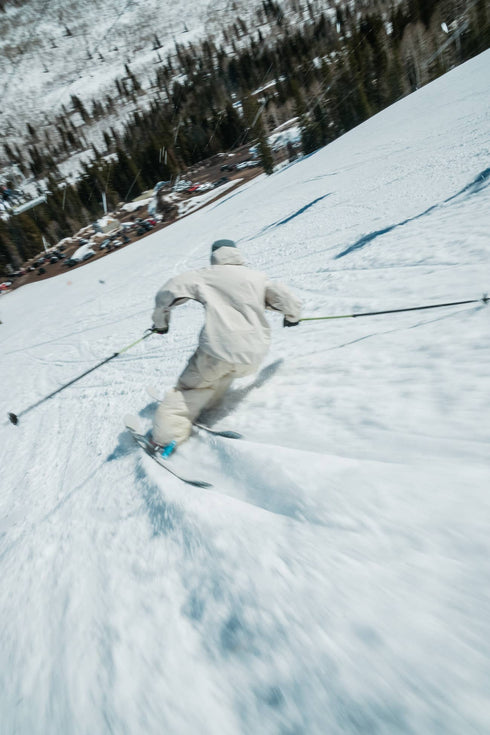 Skier carving on Armada Stranger 100 skis