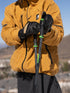 Skier holding Armada Legion ski poles in Black/Lime