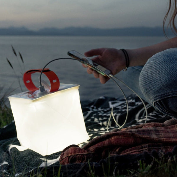 LuminAID PackLite Max 2-in-1 Camping Lantern and Phone Charger, a dual-purpose inflatable light source for illumination and device charging.