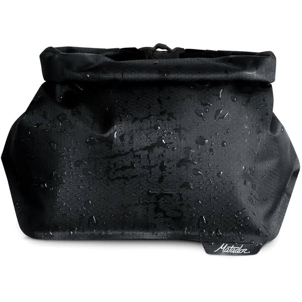 Matador FlatPak Waterproof Toiletry Case, a durable and protective case for containing bathroom essentials and preventing leaks.
