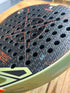 Heroe's Predator Azteca 2026 Padel Racket in black and gold, close-up detail